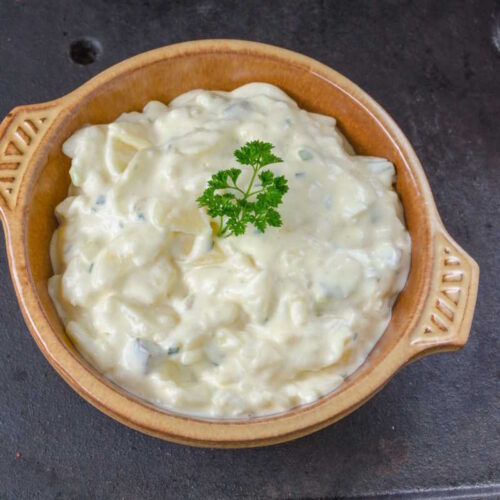 Creamy vegan potato salad with mayonnaise, pickle and diced celery.