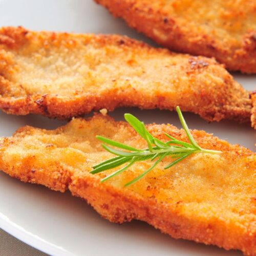 A dinner plate full of buttermilk fried chicken.