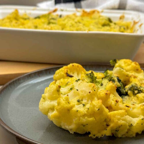 Vegan Roasted Broccoli and Cauliflower Cheese Bake with mustard and aromatic garlic seasonings.