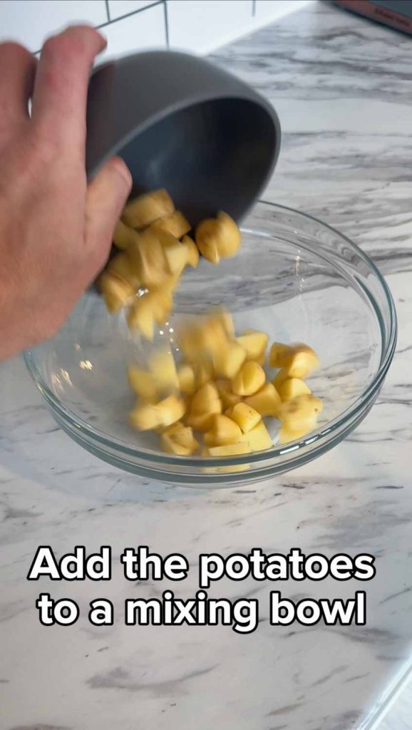 Add potatoes to bowl